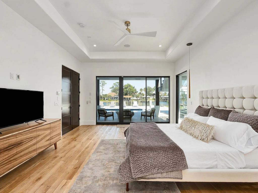 458 Shipwreck Rodd E, Santa Rosa Beach, Florida is a stunning new bayfront home boasts generous indoor and outdoor areas for entertaining, including 2,300 square feet of shell stone on the rear patio.