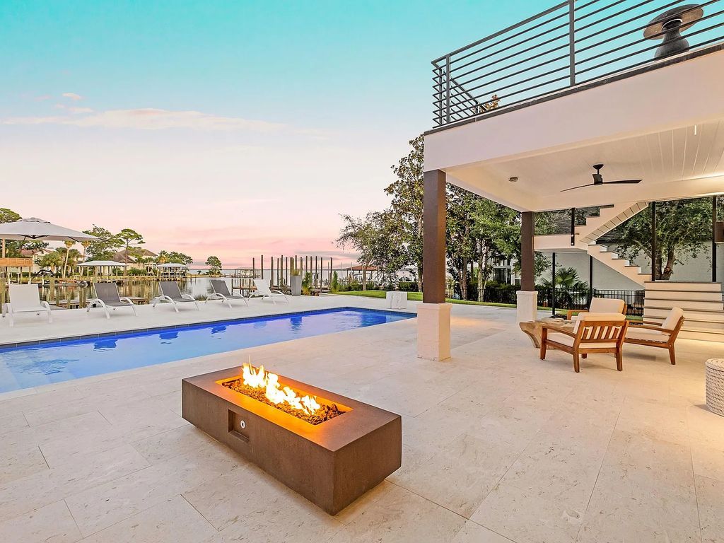 458 Shipwreck Rodd E, Santa Rosa Beach, Florida is a stunning new bayfront home boasts generous indoor and outdoor areas for entertaining, including 2,300 square feet of shell stone on the rear patio.