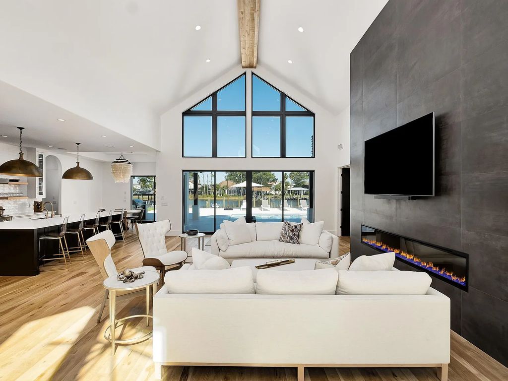 458 Shipwreck Rodd E, Santa Rosa Beach, Florida is a stunning new bayfront home boasts generous indoor and outdoor areas for entertaining, including 2,300 square feet of shell stone on the rear patio.