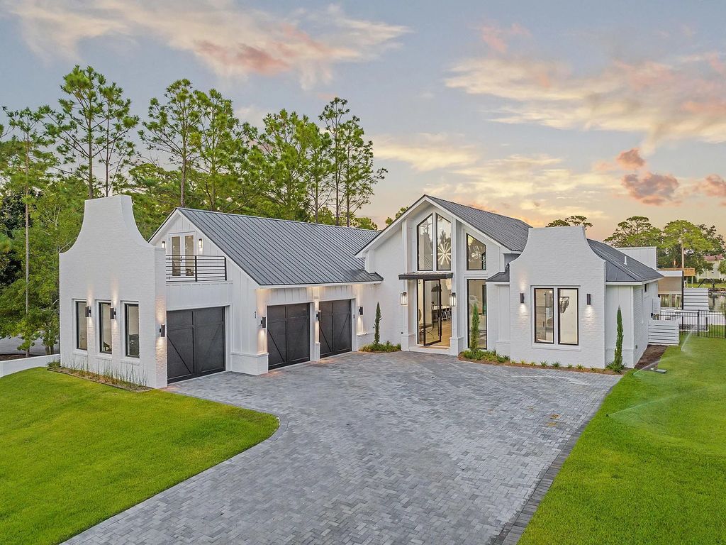 458 Shipwreck Rodd E, Santa Rosa Beach, Florida is a stunning new bayfront home boasts generous indoor and outdoor areas for entertaining, including 2,300 square feet of shell stone on the rear patio.