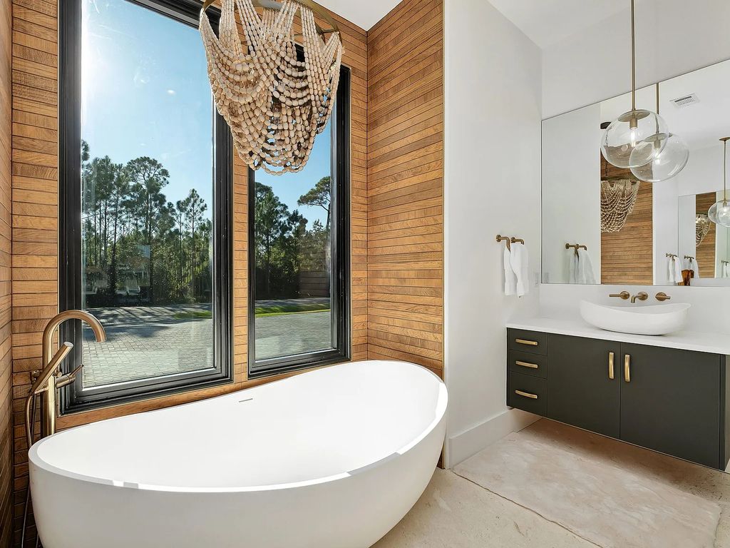 458 Shipwreck Rodd E, Santa Rosa Beach, Florida is a stunning new bayfront home boasts generous indoor and outdoor areas for entertaining, including 2,300 square feet of shell stone on the rear patio.