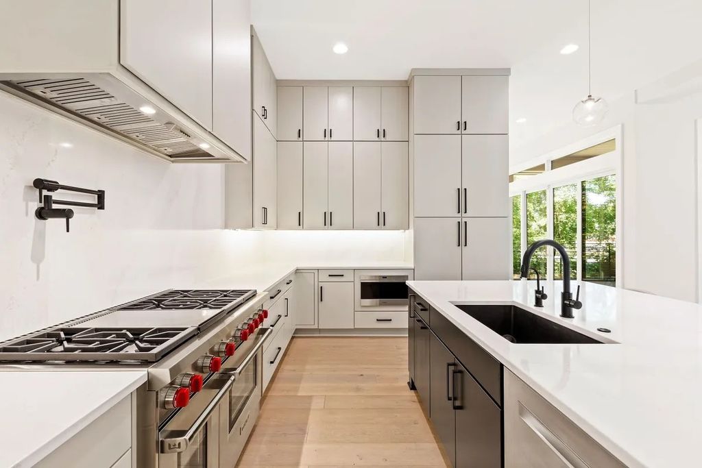 The Estate in Raleigh is a luxurious home featuring open-concept with natural light and expansive windows throughout now available for sale. This home located at 7145 N Ridge Dr, Raleigh, North Carolina; offering 04 bedrooms and 05 bathrooms with 5,702 square feet of living spaces. 