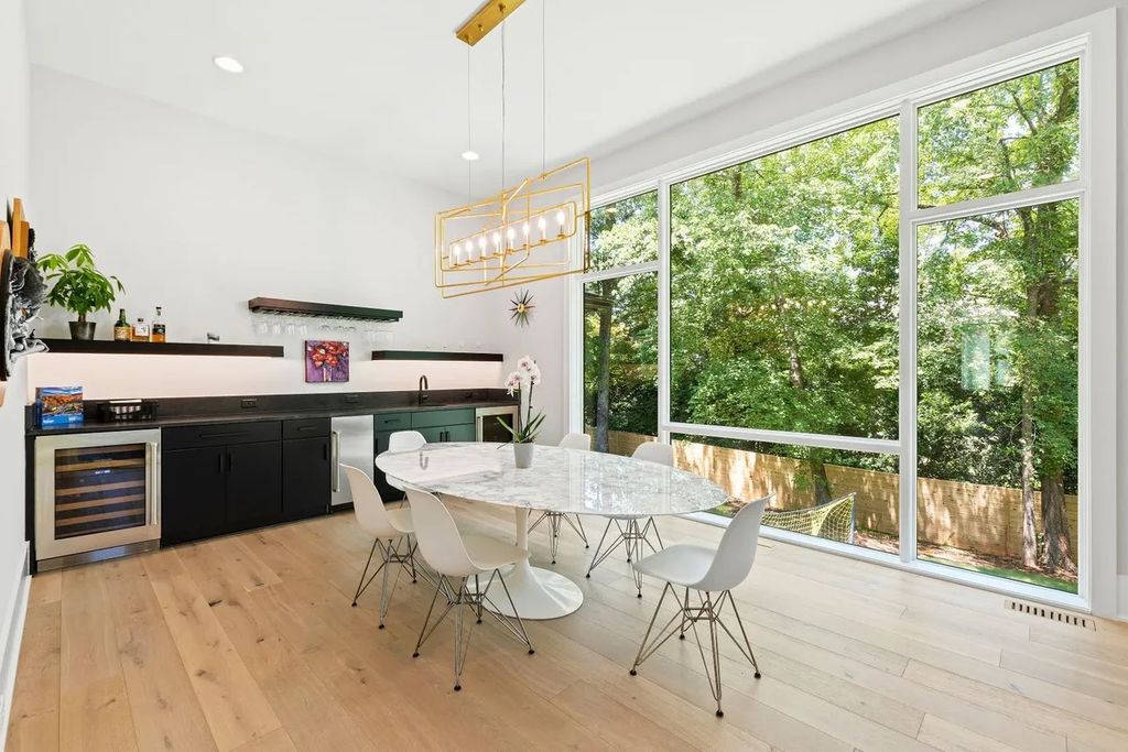 The Estate in Raleigh is a luxurious home featuring open-concept with natural light and expansive windows throughout now available for sale. This home located at 7145 N Ridge Dr, Raleigh, North Carolina; offering 04 bedrooms and 05 bathrooms with 5,702 square feet of living spaces. 