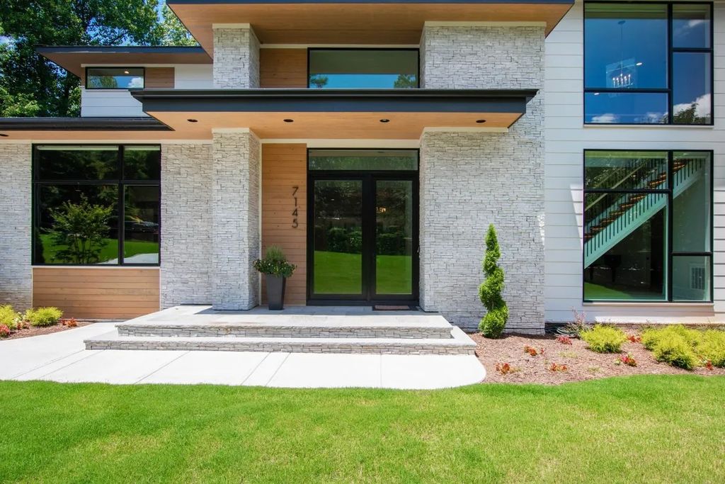 The Estate in Raleigh is a luxurious home featuring open-concept with natural light and expansive windows throughout now available for sale. This home located at 7145 N Ridge Dr, Raleigh, North Carolina; offering 04 bedrooms and 05 bathrooms with 5,702 square feet of living spaces. 