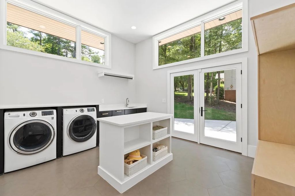 The Estate in Raleigh is a luxurious home featuring open-concept with natural light and expansive windows throughout now available for sale. This home located at 7145 N Ridge Dr, Raleigh, North Carolina; offering 04 bedrooms and 05 bathrooms with 5,702 square feet of living spaces. 
