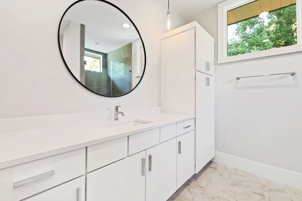 The Estate in Raleigh is a luxurious home featuring open-concept with natural light and expansive windows throughout now available for sale. This home located at 7145 N Ridge Dr, Raleigh, North Carolina; offering 04 bedrooms and 05 bathrooms with 5,702 square feet of living spaces. 