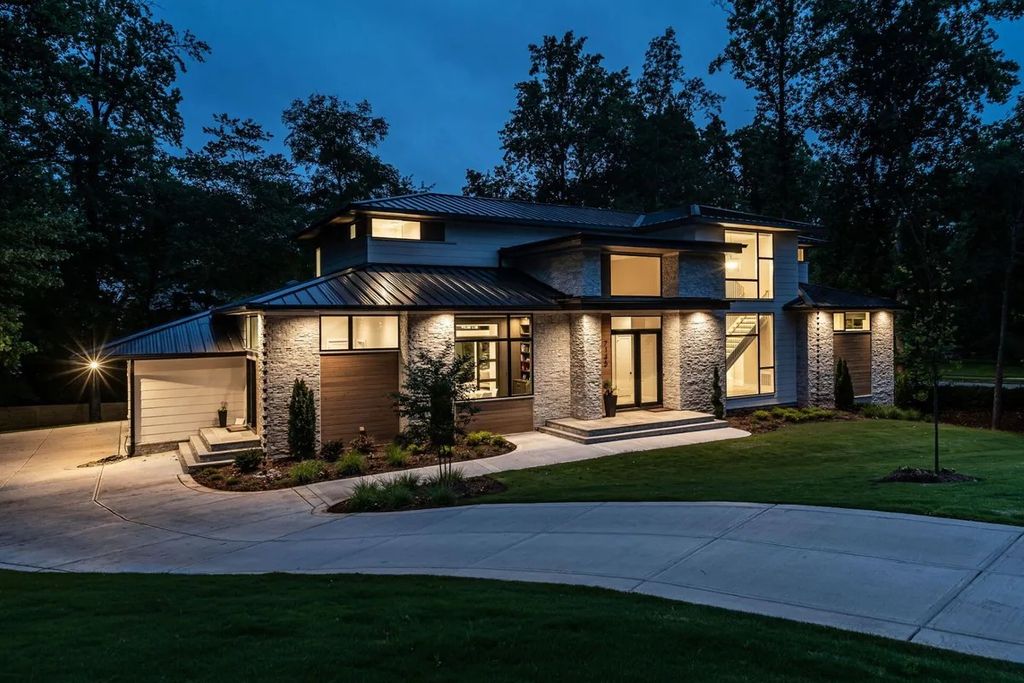 The Estate in Raleigh is a luxurious home featuring open-concept with natural light and expansive windows throughout now available for sale. This home located at 7145 N Ridge Dr, Raleigh, North Carolina; offering 04 bedrooms and 05 bathrooms with 5,702 square feet of living spaces. 