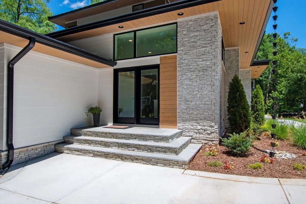 The Estate in Raleigh is a luxurious home featuring open-concept with natural light and expansive windows throughout now available for sale. This home located at 7145 N Ridge Dr, Raleigh, North Carolina; offering 04 bedrooms and 05 bathrooms with 5,702 square feet of living spaces. 