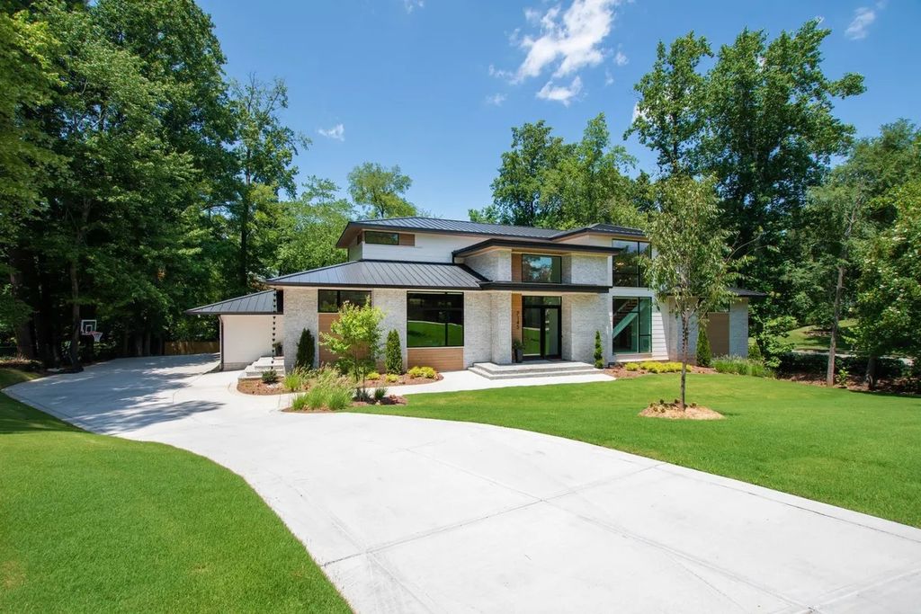 The Estate in Raleigh is a luxurious home featuring open-concept with natural light and expansive windows throughout now available for sale. This home located at 7145 N Ridge Dr, Raleigh, North Carolina; offering 04 bedrooms and 05 bathrooms with 5,702 square feet of living spaces. 