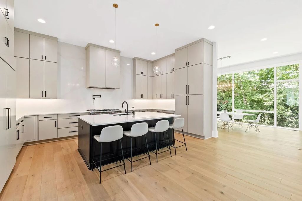 The Estate in Raleigh is a luxurious home featuring open-concept with natural light and expansive windows throughout now available for sale. This home located at 7145 N Ridge Dr, Raleigh, North Carolina; offering 04 bedrooms and 05 bathrooms with 5,702 square feet of living spaces. 