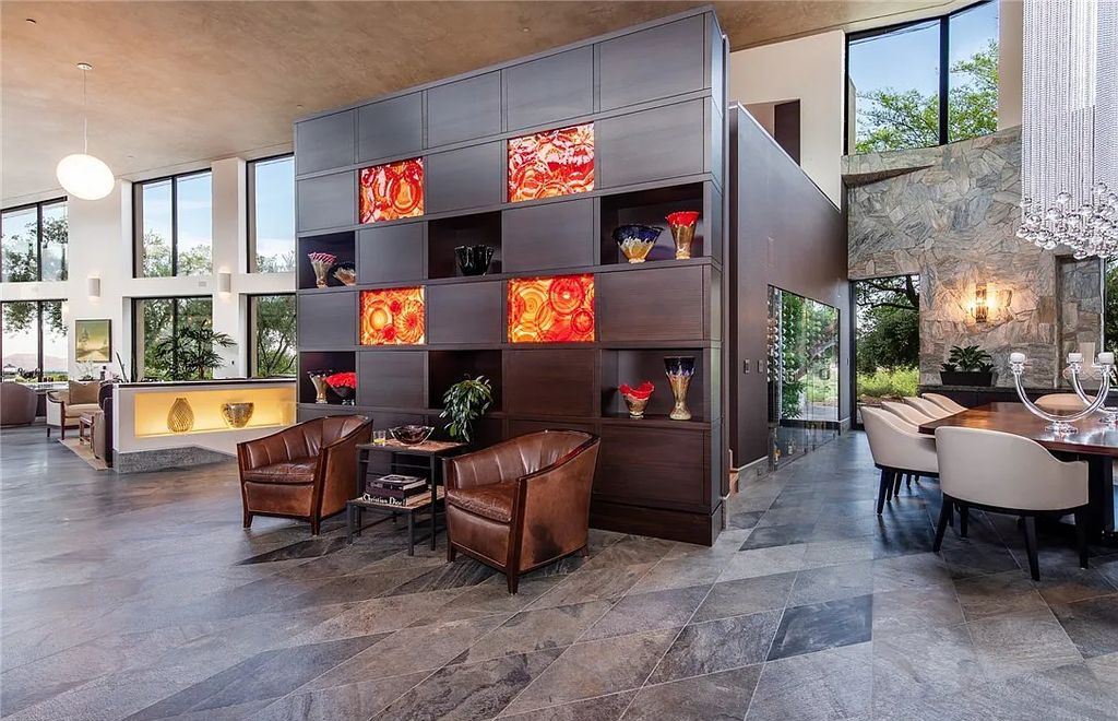 5 Promontory Ridge Drive, Las Vegas, Nevada is a desert contemporary masterpiece set on a cul-de-sac Ridge lot with unobstructed strip, city, mountain and golf course views comes with unparalleled quality of construction. 