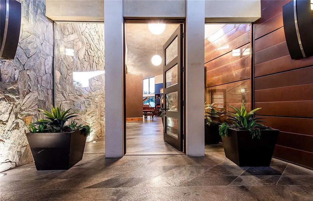 5 Promontory Ridge Drive, Las Vegas, Nevada is a desert contemporary masterpiece set on a cul-de-sac Ridge lot with unobstructed strip, city, mountain and golf course views comes with unparalleled quality of construction. 