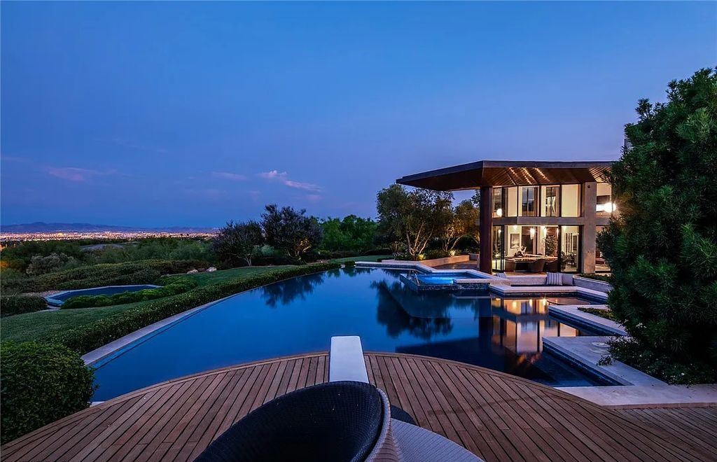 5 Promontory Ridge Drive, Las Vegas, Nevada is a desert contemporary masterpiece set on a cul-de-sac Ridge lot with unobstructed strip, city, mountain and golf course views comes with unparalleled quality of construction. 