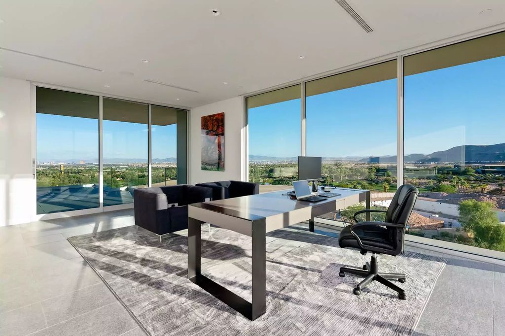 10861 Stardust Drive, Las Vegas, Nevada is spectacular property located in Discovery Land Company’s coveted and exclusive Summit Club offering the ultimate in privacy sitting on its own 1.37-acre peninsula lot.