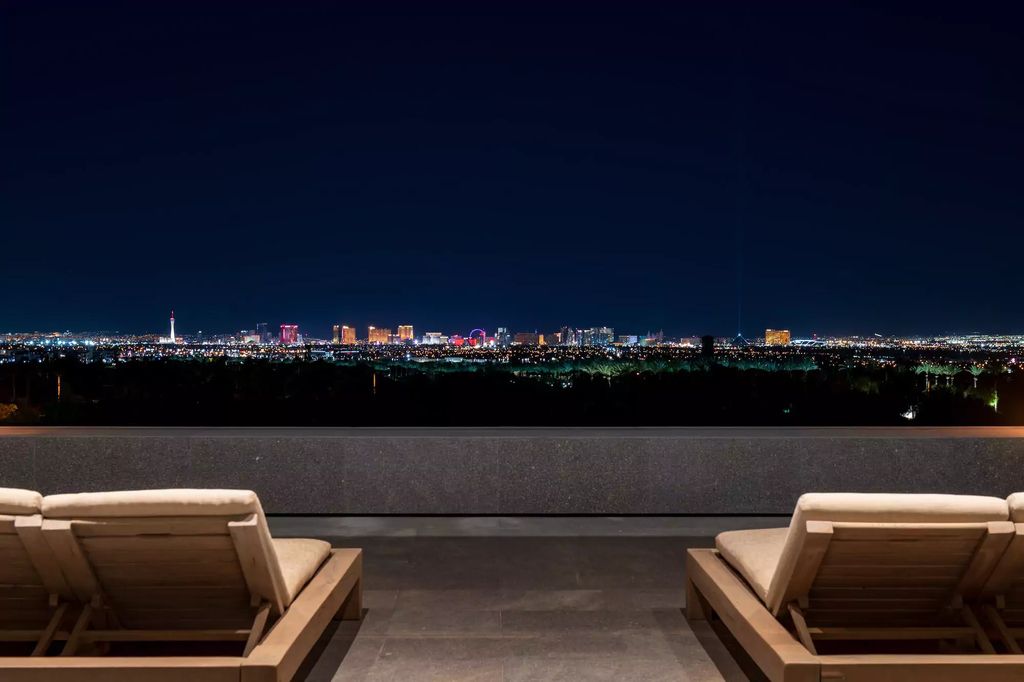 10861 Stardust Drive, Las Vegas, Nevada is spectacular property located in Discovery Land Company’s coveted and exclusive Summit Club offering the ultimate in privacy sitting on its own 1.37-acre peninsula lot.