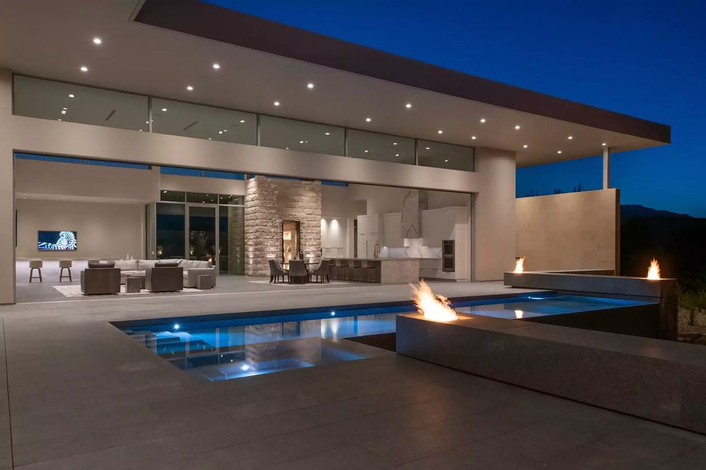10861 Stardust Drive, Las Vegas, Nevada is spectacular property located in Discovery Land Company’s coveted and exclusive Summit Club offering the ultimate in privacy sitting on its own 1.37-acre peninsula lot.