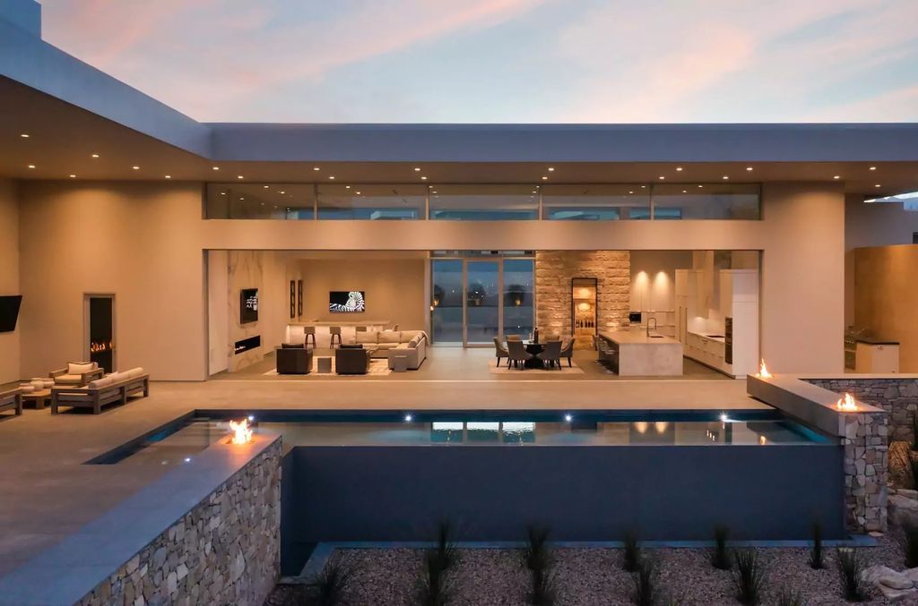 10861 Stardust Drive, Las Vegas, Nevada is spectacular property located in Discovery Land Company’s coveted and exclusive Summit Club offering the ultimate in privacy sitting on its own 1.37-acre peninsula lot.