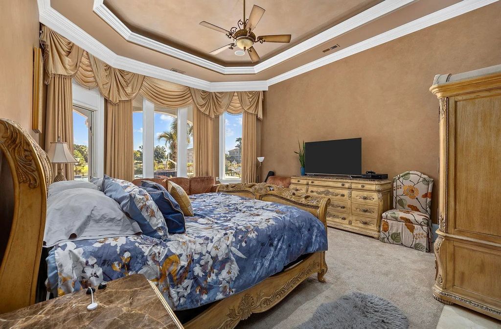 The House in Myrtle Beach is situated on 0.57 acres of land, which includes more than 200 feet of golf course and lakefront views, now available for sale. This home located at 1495 Scala Ct, Myrtle Beach, South Carolina