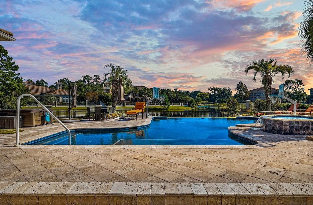 The House in Myrtle Beach is situated on 0.57 acres of land, which includes more than 200 feet of golf course and lakefront views, now available for sale. This home located at 1495 Scala Ct, Myrtle Beach, South Carolina