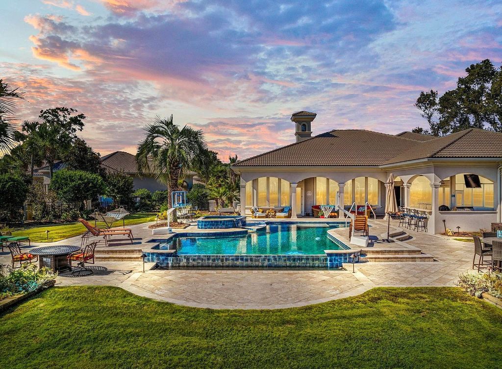 The House in Myrtle Beach is situated on 0.57 acres of land, which includes more than 200 feet of golf course and lakefront views, now available for sale. This home located at 1495 Scala Ct, Myrtle Beach, South Carolina