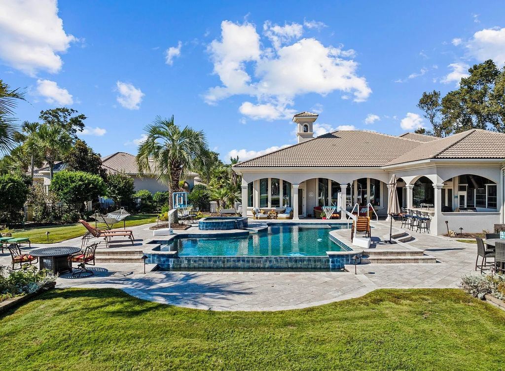 The House in Myrtle Beach is situated on 0.57 acres of land, which includes more than 200 feet of golf course and lakefront views, now available for sale. This home located at 1495 Scala Ct, Myrtle Beach, South Carolina