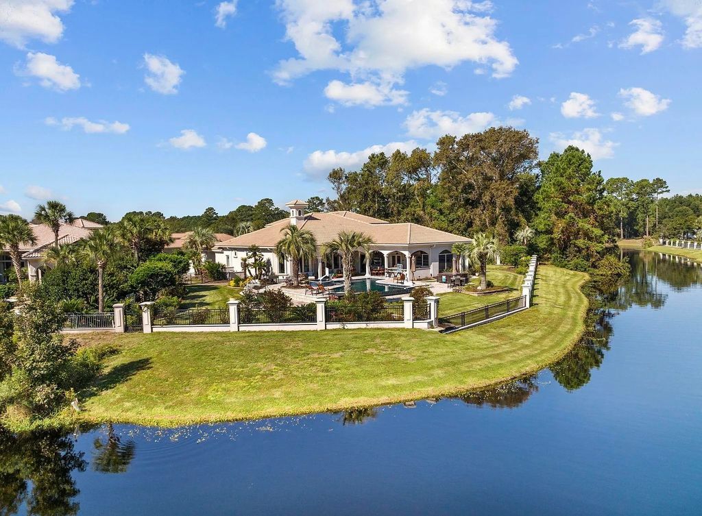 The House in Myrtle Beach is situated on 0.57 acres of land, which includes more than 200 feet of golf course and lakefront views, now available for sale. This home located at 1495 Scala Ct, Myrtle Beach, South Carolina