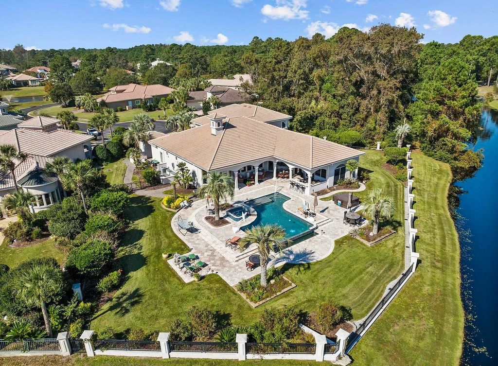 The House in Myrtle Beach is situated on 0.57 acres of land, which includes more than 200 feet of golf course and lakefront views, now available for sale. This home located at 1495 Scala Ct, Myrtle Beach, South Carolina