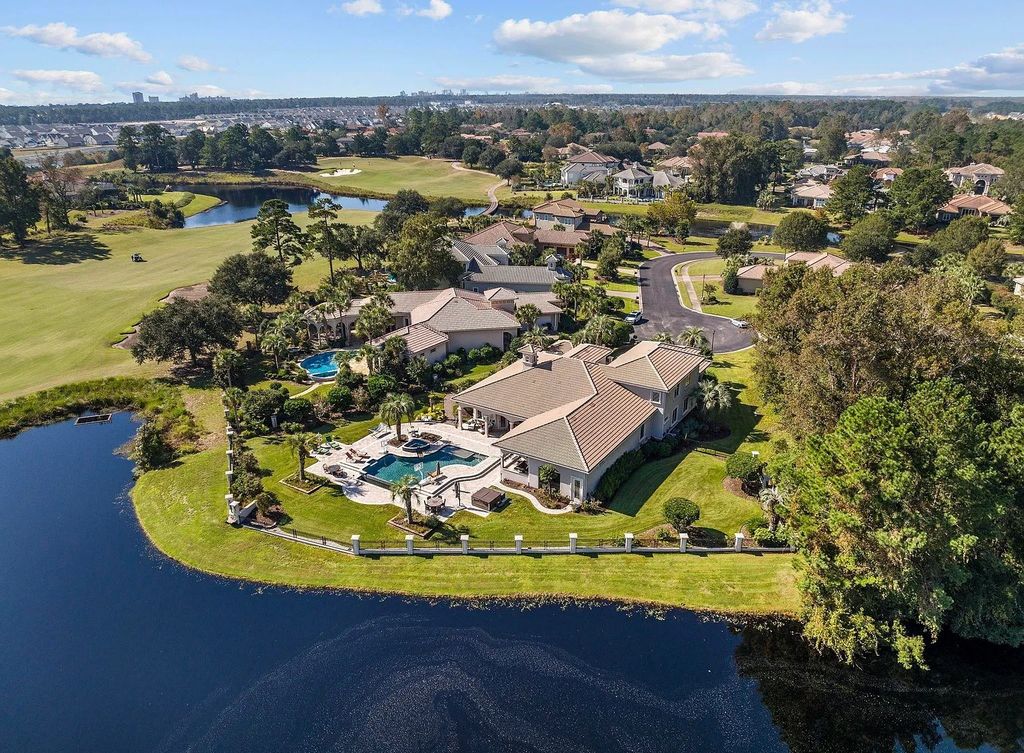 The House in Myrtle Beach is situated on 0.57 acres of land, which includes more than 200 feet of golf course and lakefront views, now available for sale. This home located at 1495 Scala Ct, Myrtle Beach, South Carolina