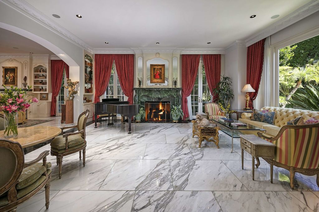 815 Cord Circle, Beverly Hills, California is a palatial residence sited on over a 1/2 acre with complete privacy, grounds are magical in every sense featuring a Roman style pool, fresco paintings and formal gardens.