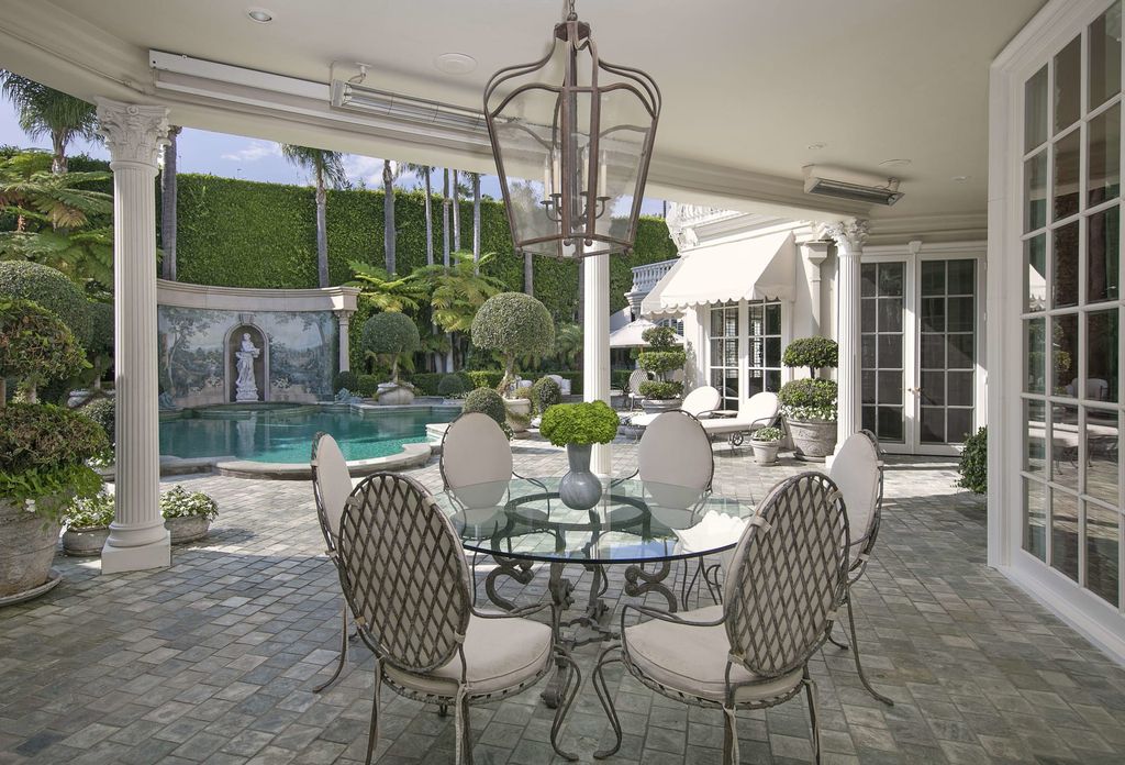 815 Cord Circle, Beverly Hills, California is a palatial residence sited on over a 1/2 acre with complete privacy, grounds are magical in every sense featuring a Roman style pool, fresco paintings and formal gardens.