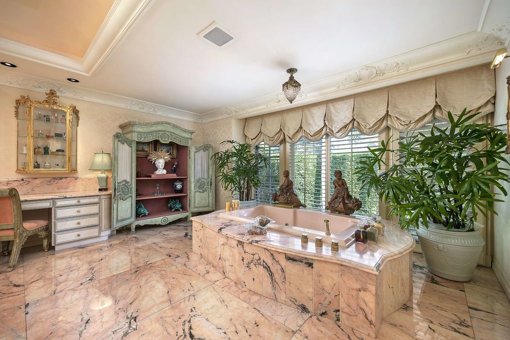 815 Cord Circle, Beverly Hills, California is a palatial residence sited on over a 1/2 acre with complete privacy, grounds are magical in every sense featuring a Roman style pool, fresco paintings and formal gardens.