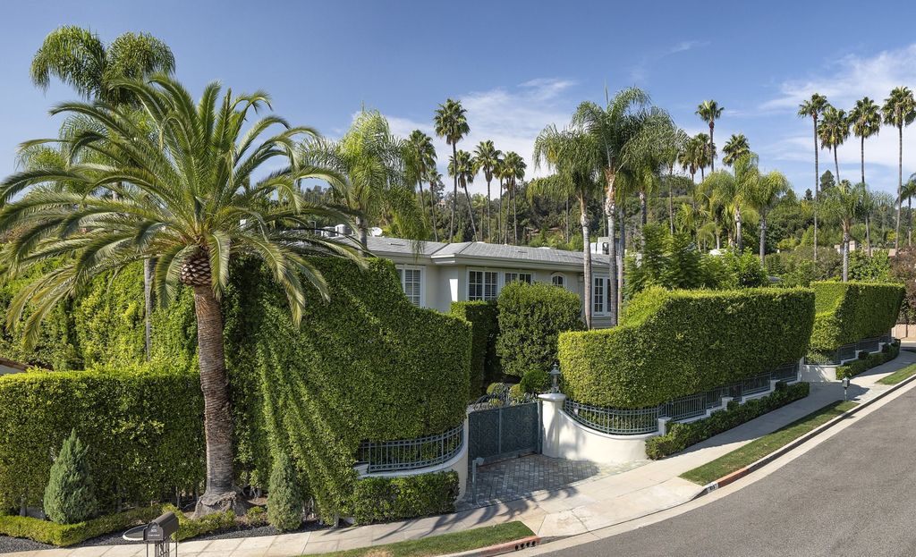 815 Cord Circle, Beverly Hills, California is a palatial residence sited on over a 1/2 acre with complete privacy, grounds are magical in every sense featuring a Roman style pool, fresco paintings and formal gardens.