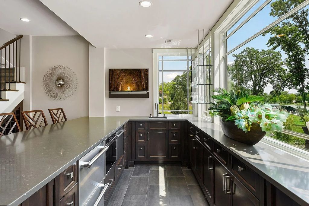 The Home in Excelsior is built by the most awarded architectural designer and builder in the state - Charles Cudd Co, now available for sale. This home located at 3776 Woodland Cove Pkwy, Excelsior, Minnesota