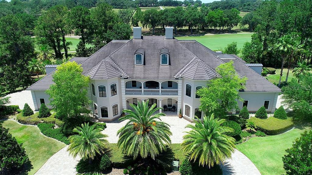 3956 NW 85th Terrace, Ocala, Florida is a spectacular residence perfect for family living and entertaining with open floor plan, resort style screen enclosed pool, summer kitchen, beautiful sunsets overlooking the golf course.