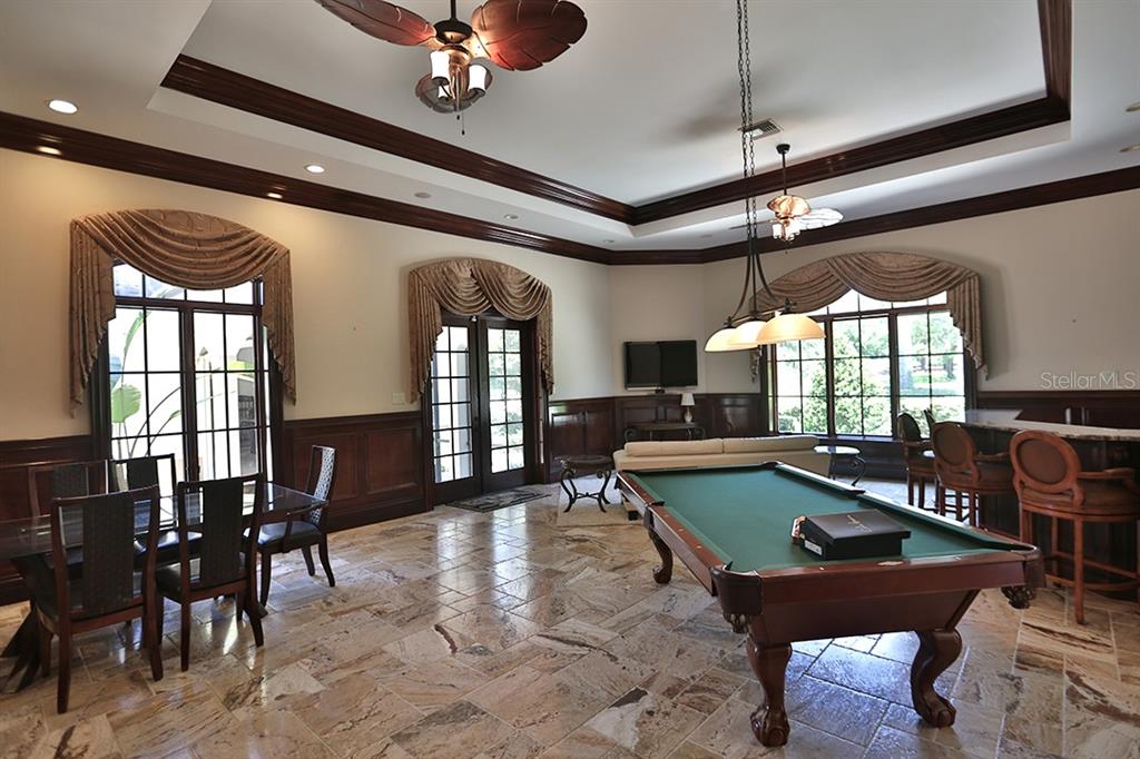 3956 NW 85th Terrace, Ocala, Florida is a spectacular residence perfect for family living and entertaining with open floor plan, resort style screen enclosed pool, summer kitchen, beautiful sunsets overlooking the golf course.