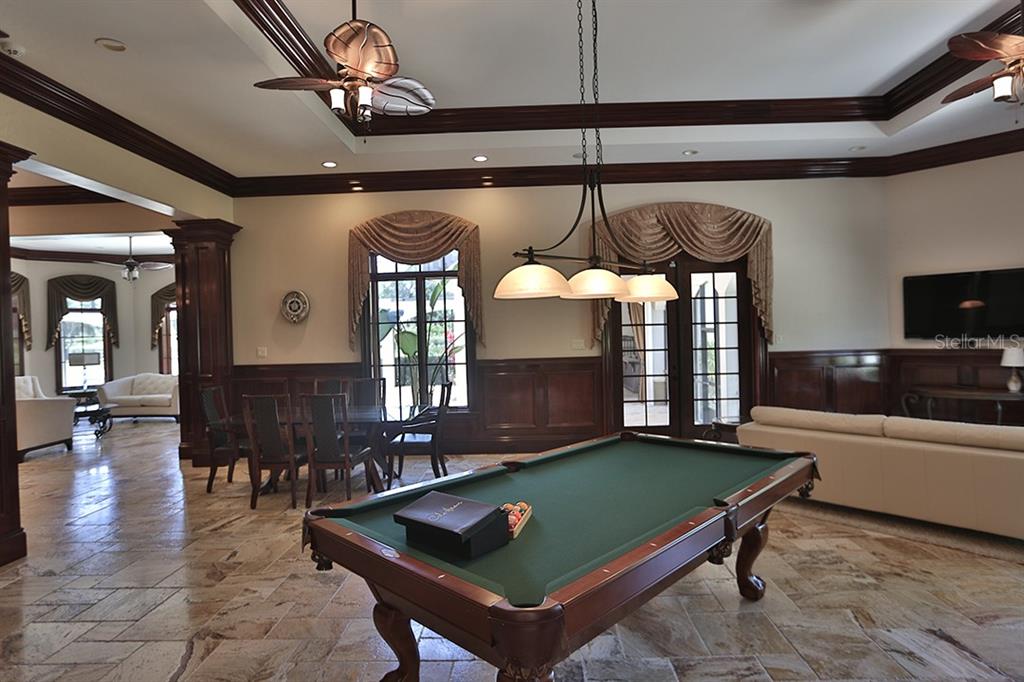 3956 NW 85th Terrace, Ocala, Florida is a spectacular residence perfect for family living and entertaining with open floor plan, resort style screen enclosed pool, summer kitchen, beautiful sunsets overlooking the golf course.