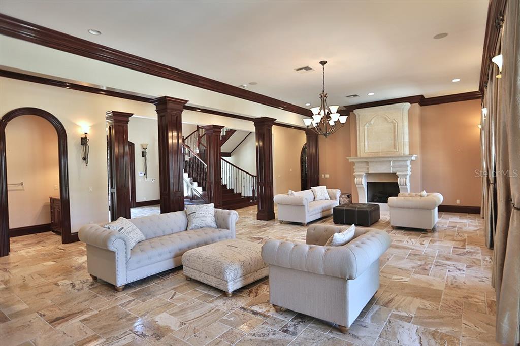 3956 NW 85th Terrace, Ocala, Florida is a spectacular residence perfect for family living and entertaining with open floor plan, resort style screen enclosed pool, summer kitchen, beautiful sunsets overlooking the golf course.