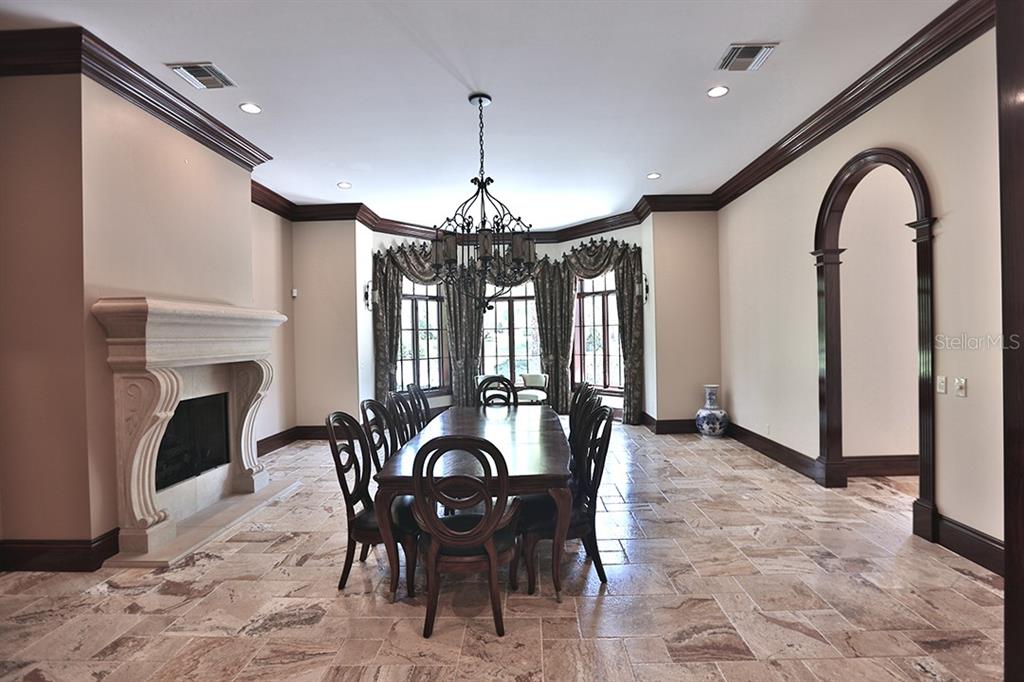 3956 NW 85th Terrace, Ocala, Florida is a spectacular residence perfect for family living and entertaining with open floor plan, resort style screen enclosed pool, summer kitchen, beautiful sunsets overlooking the golf course.