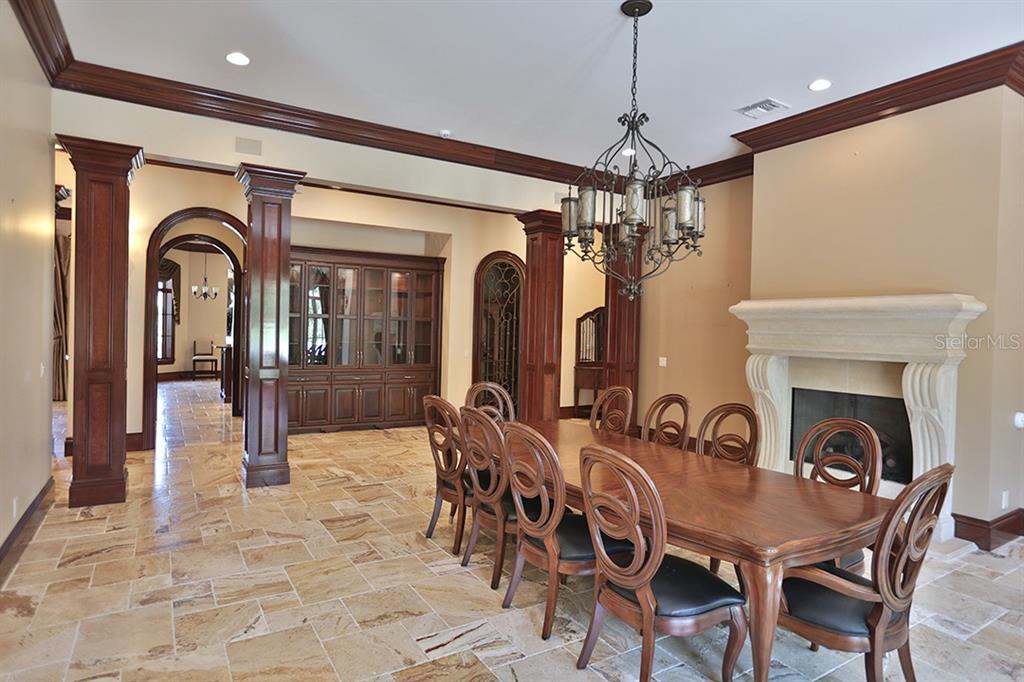 3956 NW 85th Terrace, Ocala, Florida is a spectacular residence perfect for family living and entertaining with open floor plan, resort style screen enclosed pool, summer kitchen, beautiful sunsets overlooking the golf course.