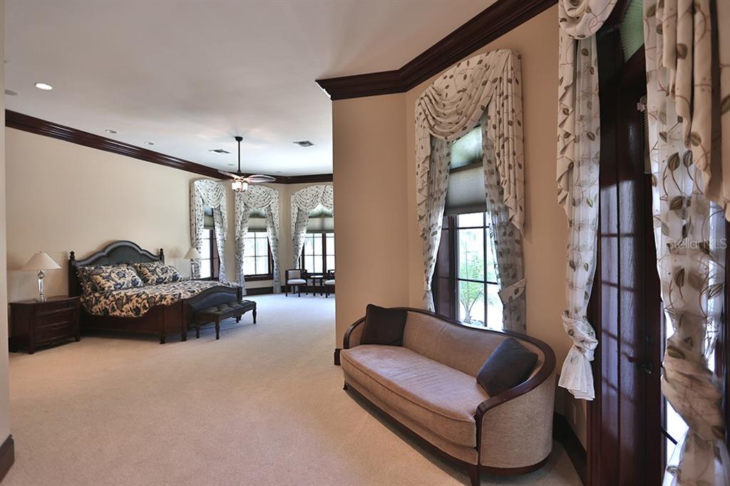 3956 NW 85th Terrace, Ocala, Florida is a spectacular residence perfect for family living and entertaining with open floor plan, resort style screen enclosed pool, summer kitchen, beautiful sunsets overlooking the golf course.