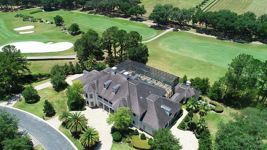 3956 NW 85th Terrace, Ocala, Florida is a spectacular residence perfect for family living and entertaining with open floor plan, resort style screen enclosed pool, summer kitchen, beautiful sunsets overlooking the golf course.