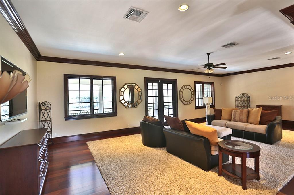 3956 NW 85th Terrace, Ocala, Florida is a spectacular residence perfect for family living and entertaining with open floor plan, resort style screen enclosed pool, summer kitchen, beautiful sunsets overlooking the golf course.