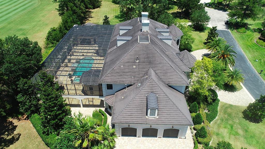 3956 NW 85th Terrace, Ocala, Florida is a spectacular residence perfect for family living and entertaining with open floor plan, resort style screen enclosed pool, summer kitchen, beautiful sunsets overlooking the golf course.