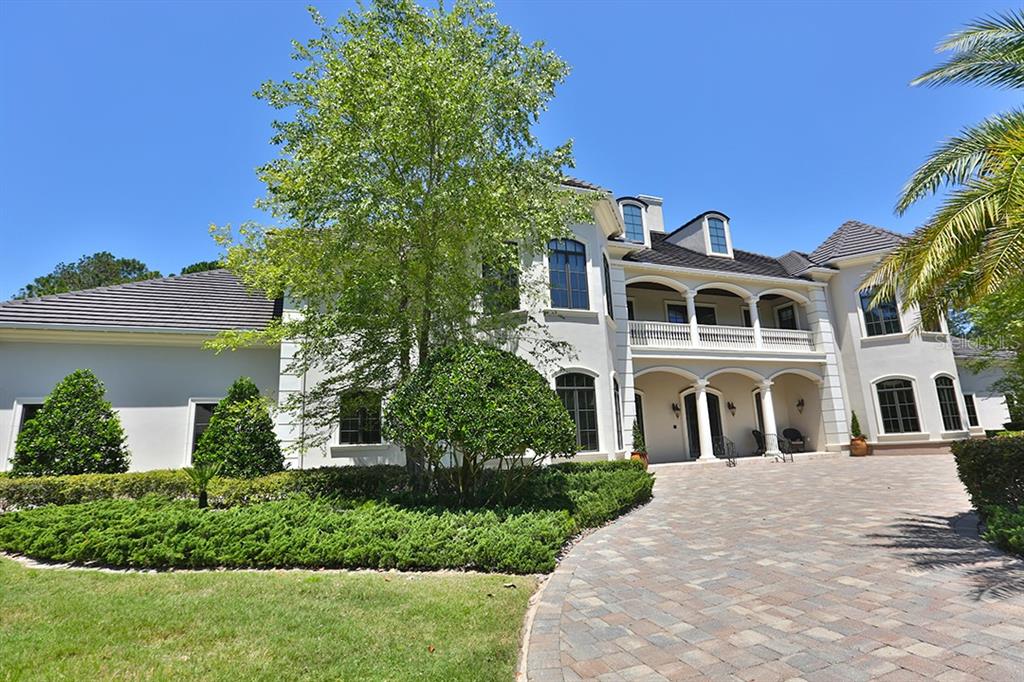 3956 NW 85th Terrace, Ocala, Florida is a spectacular residence perfect for family living and entertaining with open floor plan, resort style screen enclosed pool, summer kitchen, beautiful sunsets overlooking the golf course.