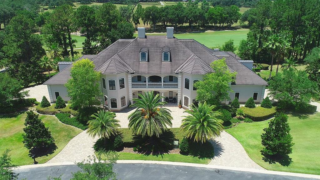 3956 NW 85th Terrace, Ocala, Florida is a spectacular residence perfect for family living and entertaining with open floor plan, resort style screen enclosed pool, summer kitchen, beautiful sunsets overlooking the golf course.
