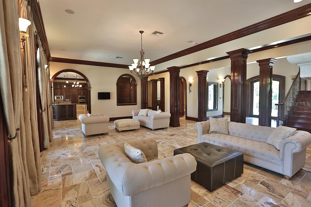 3956 NW 85th Terrace, Ocala, Florida is a spectacular residence perfect for family living and entertaining with open floor plan, resort style screen enclosed pool, summer kitchen, beautiful sunsets overlooking the golf course.