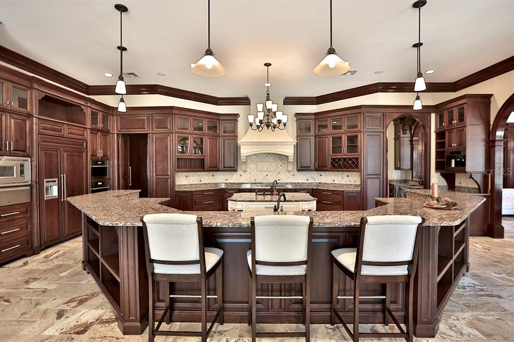 3956 NW 85th Terrace, Ocala, Florida is a spectacular residence perfect for family living and entertaining with open floor plan, resort style screen enclosed pool, summer kitchen, beautiful sunsets overlooking the golf course.