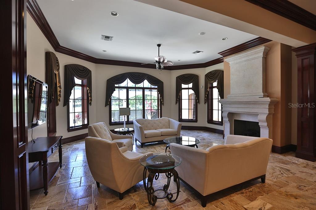 3956 NW 85th Terrace, Ocala, Florida is a spectacular residence perfect for family living and entertaining with open floor plan, resort style screen enclosed pool, summer kitchen, beautiful sunsets overlooking the golf course.
