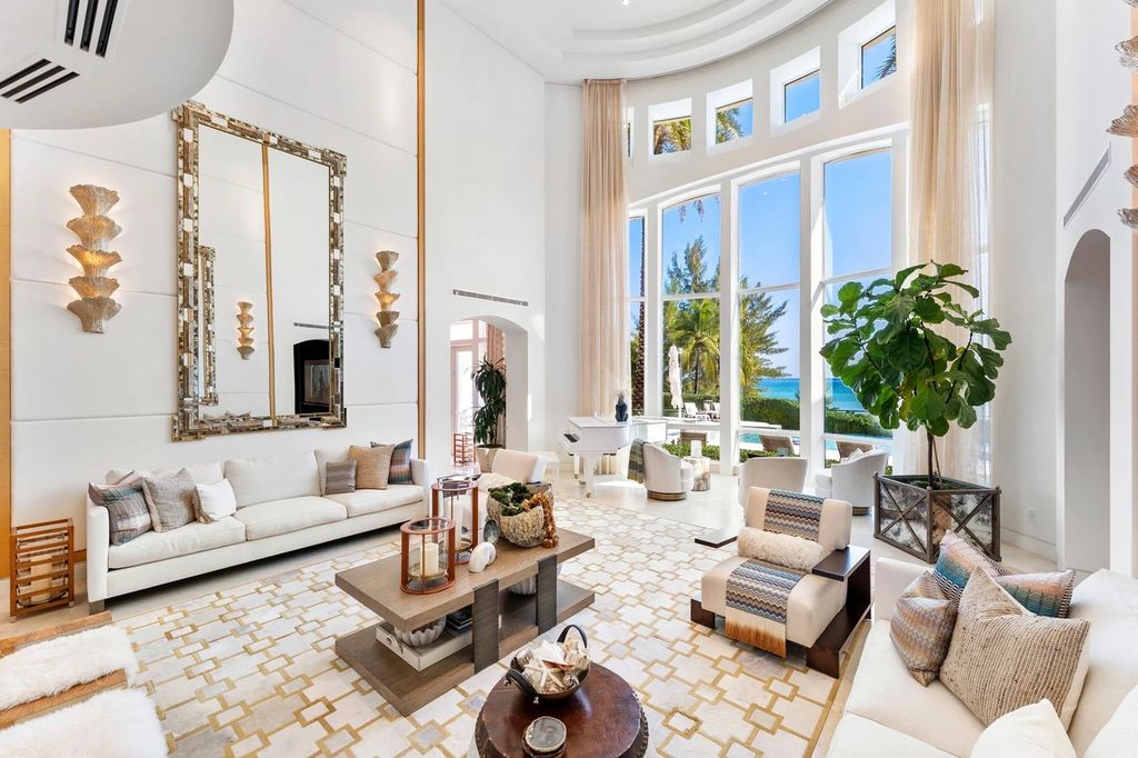 317 Ocean Boulevard, Golden Beach, Florida is an exceptional ocean front estate with luxurious amenities including formal dining room with maple paneling, movie theater, elevator, help quarters, finished basement, gym, and 2 large storage rooms. 