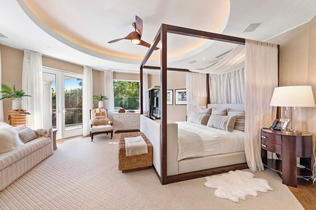 317 Ocean Boulevard, Golden Beach, Florida is an exceptional ocean front estate with luxurious amenities including formal dining room with maple paneling, movie theater, elevator, help quarters, finished basement, gym, and 2 large storage rooms. 